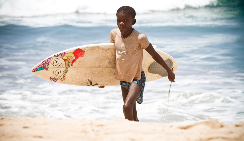 The old fishermen of this town told me of a young boy who, “does not fear the sea.”  They call him “Bay Boy” and they say he would go out in the surf on a wooden plank and stay out for eight hours at a time. Photo: Brody/<a href=\"http://www.surfresource.org/\" target=_blank>SurfResource.org</a>